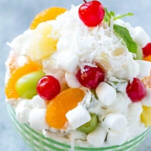 This recipe for ambrosia salad is a variety of colorful fruit with marshmallows and coconut, tossed in a light and creamy dressing. An easy salad that's a classic for good reason, people always beg me for the recipe!