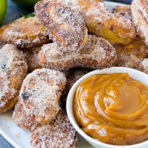 A platter of cinnamon sugar coated apple fries served with caramel dip.