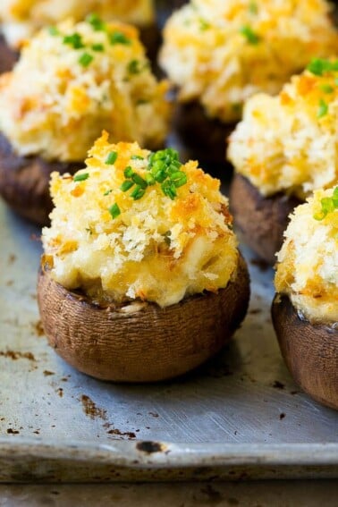 Crab stuffed mushrooms with cremini mushroom caps filled with a creamy seafood filling.