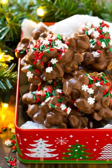 A holiday tin filled with crock pot candy.