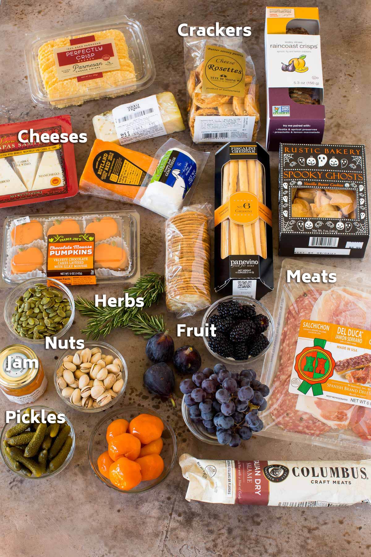 Ingredients including packages of crackers, meats and cheeses.