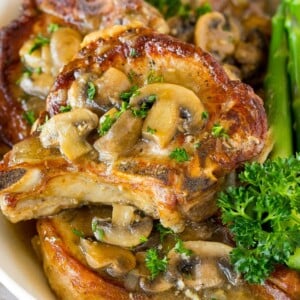 Instant Pot pork chops topped with mushroom gravy.