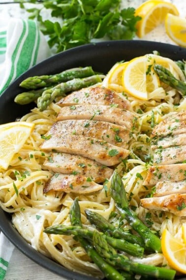 This recipe for lemon asparagus pasta combines tender asparagus and grilled chicken with pasta in a lemon cream sauce. It's a delicious and hearty entree that everyone will want seconds of!