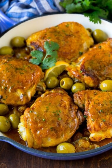 Moroccan chicken with olives and raisins in a skillet.