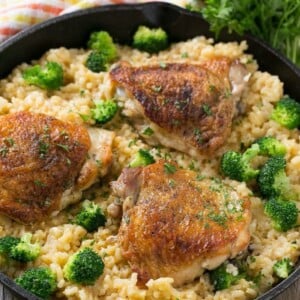 This one pot chicken with cheddar broccoli rice combines classic flavors for a quick and easy dinner. Chicken thighs are cooked with a creamy cheesy broccoli cheddar rice for a complete meal without all the cleanup.