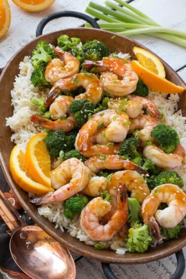 This orange shrimp and broccoli with garlic sesame fried rice is the perfect quick and easy meal for a busy weeknight or for entertaining guests. Ad