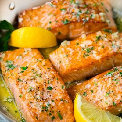 Pan seared salmon fillets in garlic butter sauce.