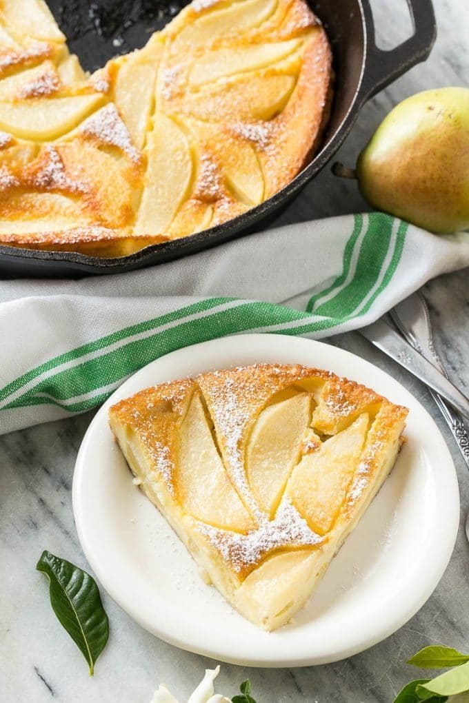 A slice of pear custard pie on a plate.