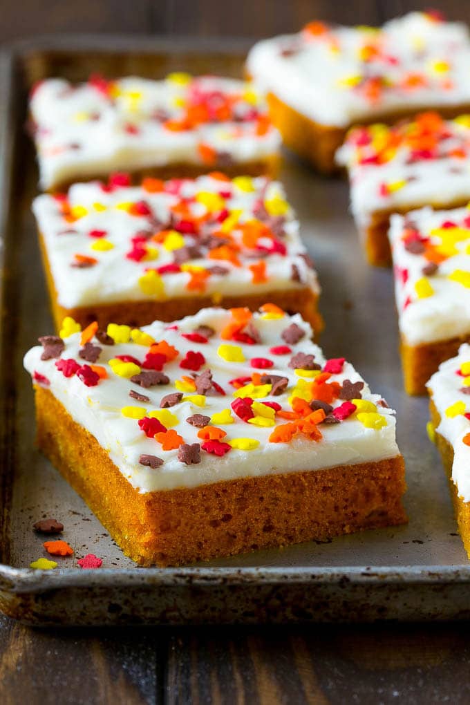 A baking sheet of frosted pumpkin bars.