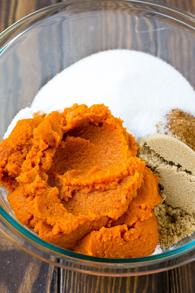 Pumpkin puree, brown sugar and flour in a bowl.