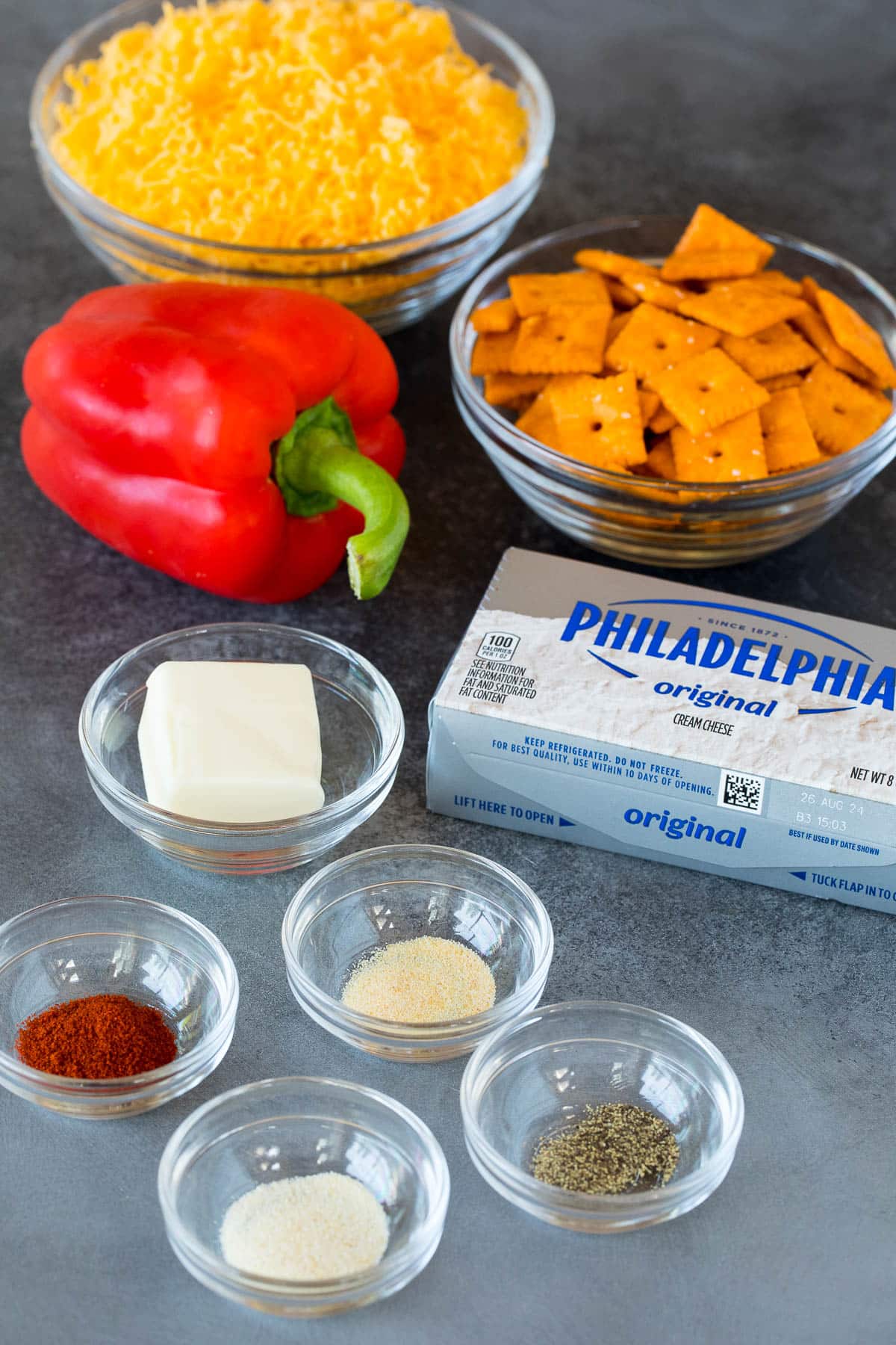 Ingredients including cream cheese, cheddar cheese, spices and cheese crackers.