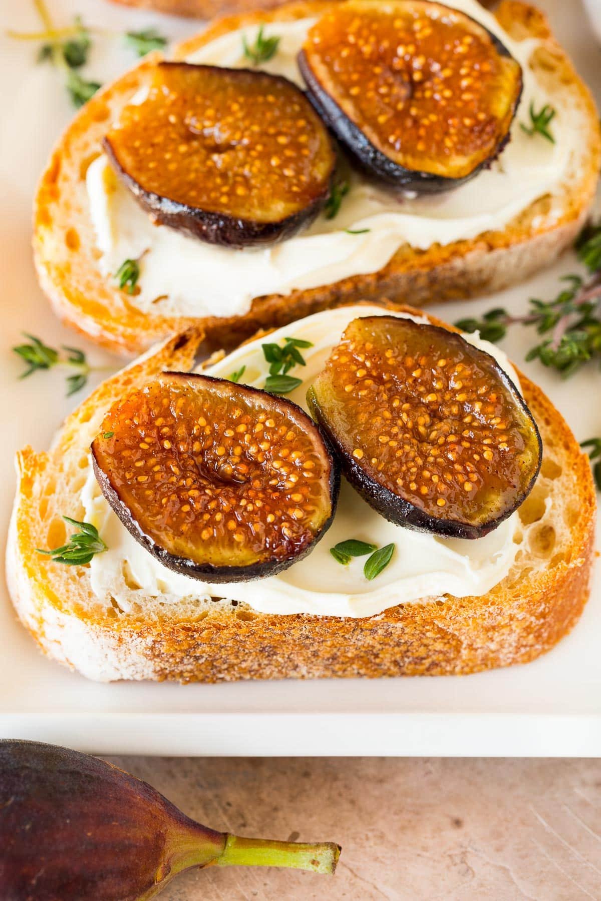 Roasted figs on crostini with creamy cheese.