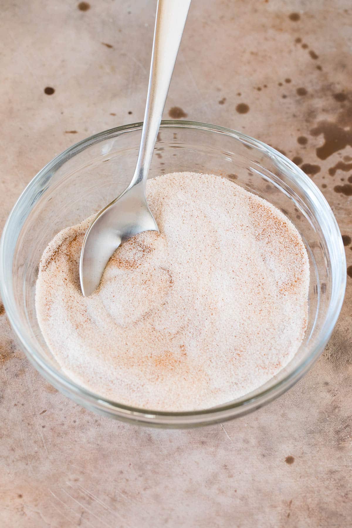 Sugar and spices mixed together in a bowl.