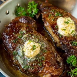 Sirloin steak topped with garlic butter and parsley.