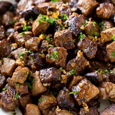 Bites of sirloin steak in a garlic sauce.