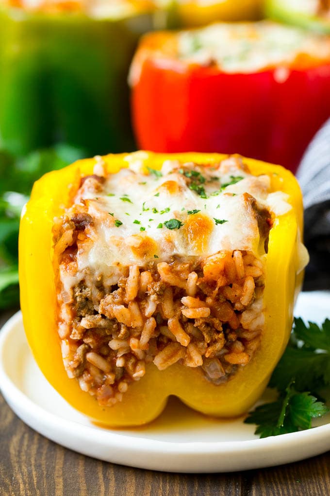 A stuffed bell pepper cut open on a plate.