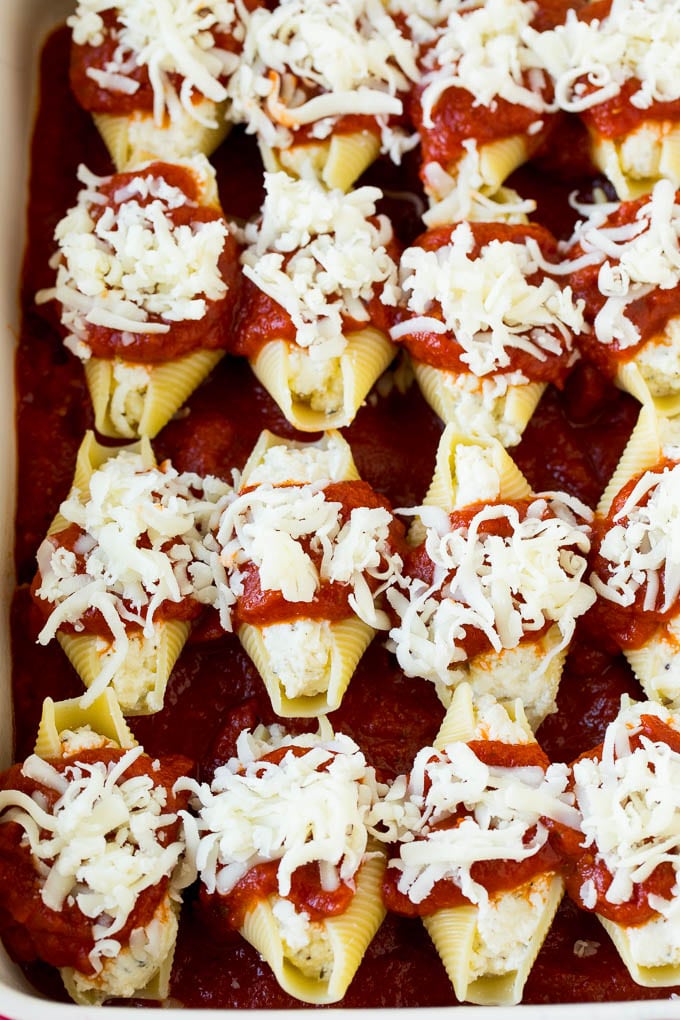 Filled pasta topped with marinara sauce and shredded cheese.