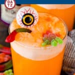 This witches brew is a spooky Halloween punch made with orange soda, orange sherbet and pineapple juice, then decorated with worms and spiders.